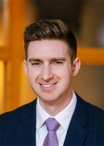 Headshot of Connor Traut in suit